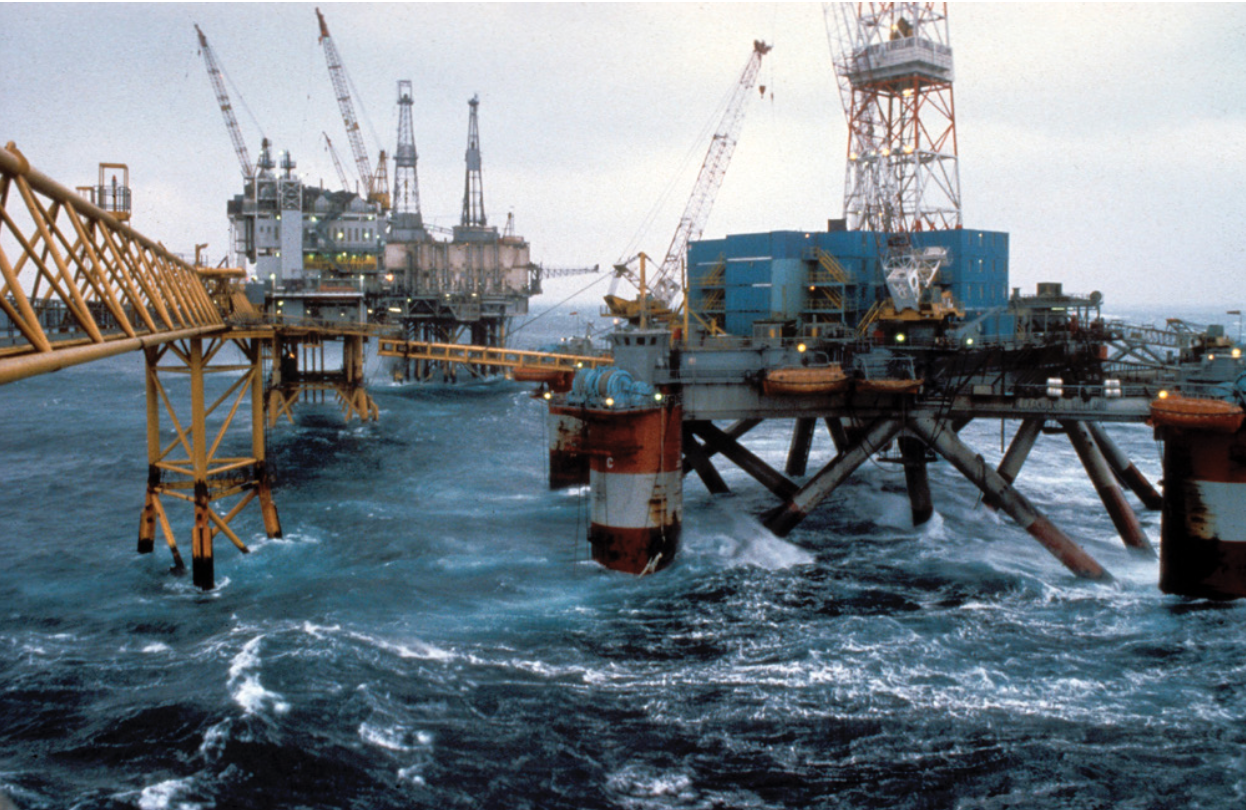 Figure 2: Alexander L. Kielland (right) before the disaster. The rig was contracted by Stavanger-based company A. Gowart-Olsen & Co in 1973. It was a semi-submersible Pentagon drilling rig with five legs, specifically designed for demanding weather conditions. The rig was built at the CFEM shipyard in France and completed in June 1976. Due to a lack of drilling assignments, it was converted into an accommodation rig and was solely used for lodging throughout its lifespan. Photo: ConocoPhillips / Norwegian Petroleum Museum (NOMF-02663.652)